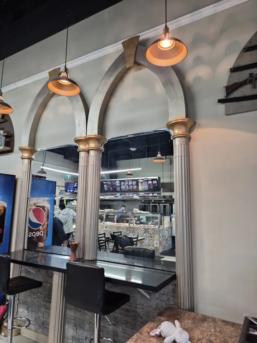 Interior with arched alcoves and pendant lights