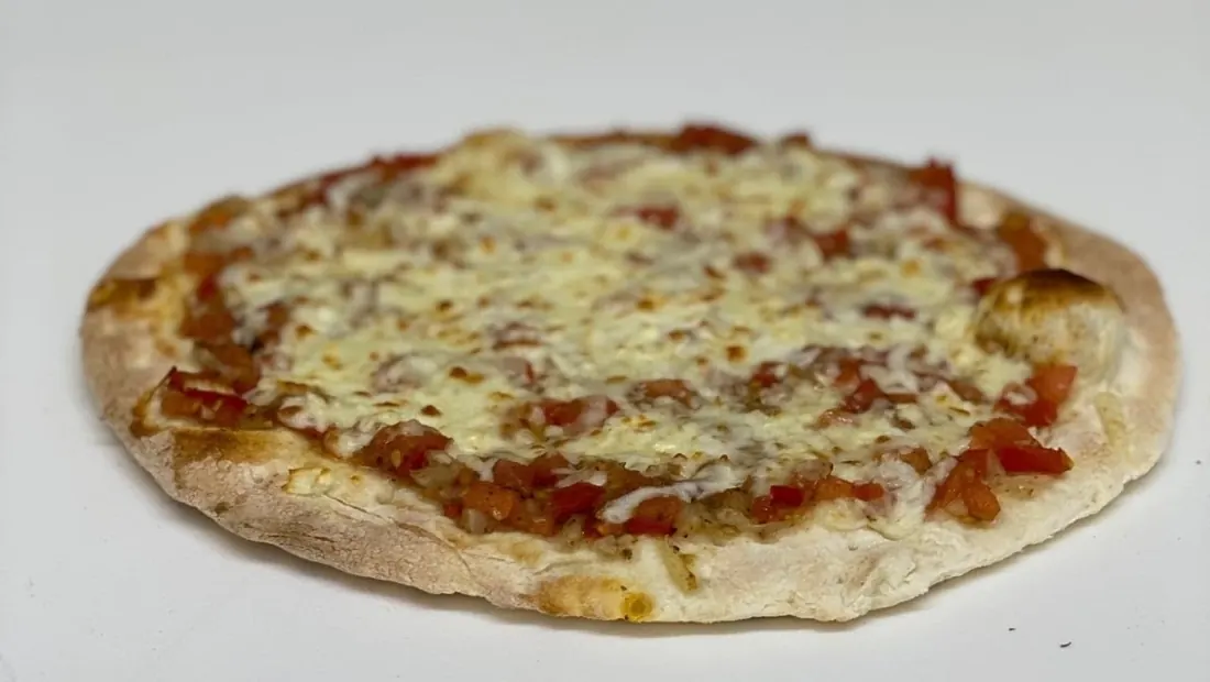 Cheese pizza baked on thin flatbread
